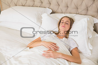 Natural content woman napping in bed