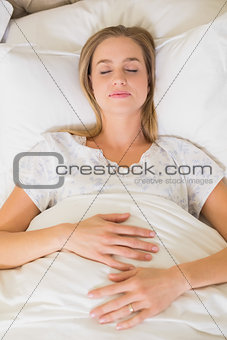 Natural peaceful woman slumbering in bed