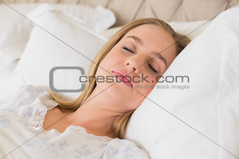 Natural content woman slumbering in bed