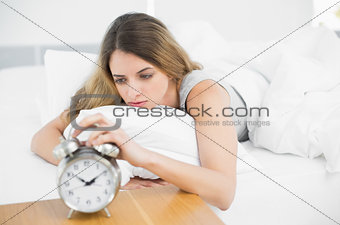 Gorgeous tired woman lying on her bed
