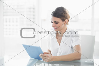 Content businesswoman working with her tablet