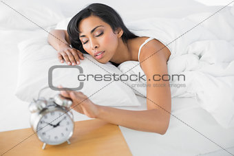 Tired young woman lying in her bed sleeping