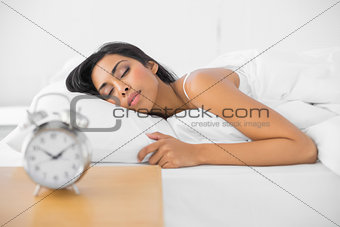 Lovely sleeping woman lying in her bed