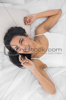 Beautiful natural woman phoning with smartphone