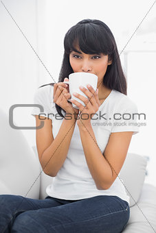 Content relaxed woman drinking of cup