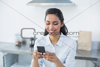 Content woman text messaging with her smartphone