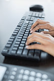 Close up of female hands typing on keyboard