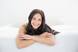 Portrait of a smiling woman in bed