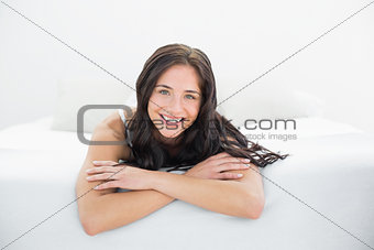 Portrait of a smiling woman in bed