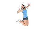 Active sporty woman gesturing thumbs up