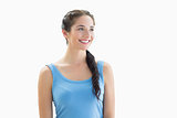 Smiling woman in blue tank top looking away