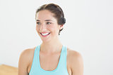 Smiling young woman in blue sports bra