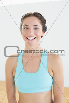 Portrait of a smiling woman in blue sports bra