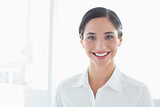 Close up portrait of a smiling young business woman
