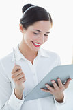 Smiling business woman with clipboard and pen