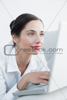 Close up of a beautiful woman using laptop