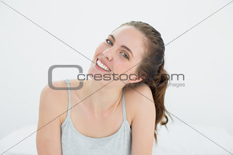 Beautiful smiling woman against the wall