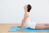 Woman stretching on exercise mat