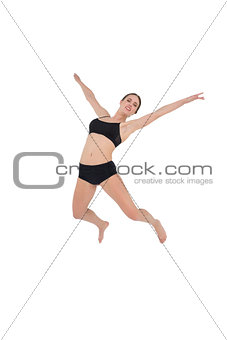Sporty woman dancing isolated on white background