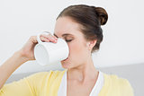 Close up of a woman drinking coffee