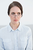 Displeased young woman wearing eye glasses