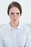 Displeased woman wearing eye glasses