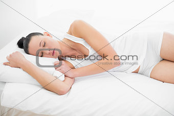 Pretty woman sleeping in bed