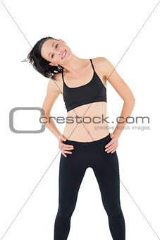 Sporty woman with hands on hips