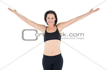 Portrait of a sporty woman with hands outstretched