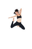 Sporty young woman jumping over white background