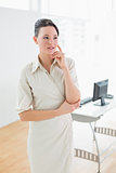 Serious businesswoman looking away in office