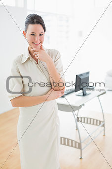 Elegant businesswoman standing in the office