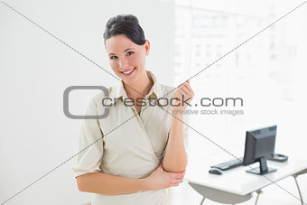 Elegant and smiling businesswoman in the office