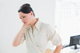 Businesswoman with neck pain in office