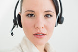 Close up of a beautiful businesswoman using headset