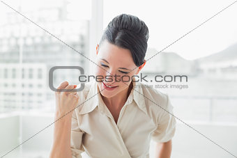 Elegant and happy businesswoman in office