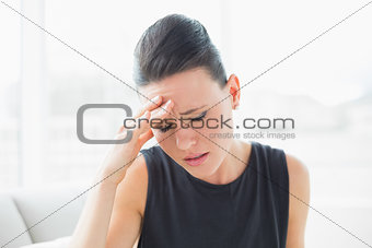 Close up of a businesswoman suffering from headache