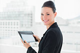 Close up of an elegant businesswoman with tablet PC
