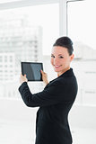 Portrait of an elegant businesswoman with tablet PC