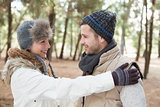 Couple in winter clothing looking at each other