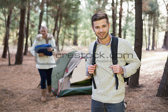 Young couple with tent in the wilderness