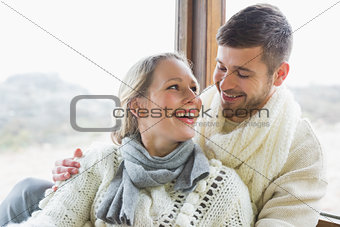 Cheerful young couple in winter clothing