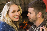 Close up of a romantic couple in front of fireplace