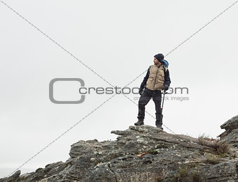 Man standing on rock against the clear sky