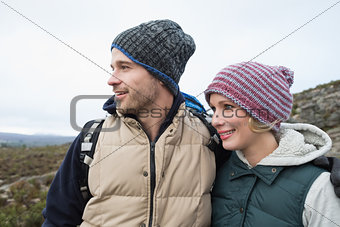Couple on a hike in the countryside against clear sky