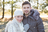 Couple in winter clothing in the woods