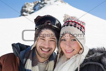 Close up portrait of a smiling couple in woolen hats