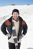 Man in warm clothing standing on snowed landscape