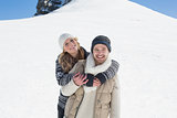 Couple in warm clothing on snowed landscape