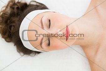 Brunette with eyes closed in beauty salon